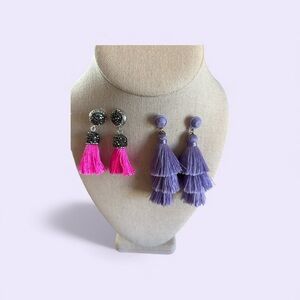 2 pairs of tassel earrings in black and pink and purple